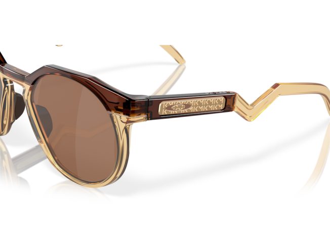 OAKLEY Htsn (52) Kylian Mbappé Dark Amber/Light Curry Prizm Tungsten